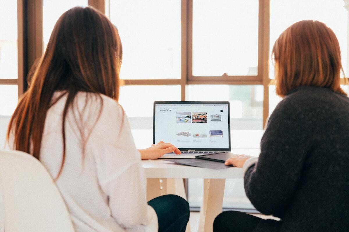 two people on a laptop